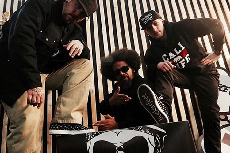 Black and white YO! surface pattern design on hip hop shoes for Bucketfeet. Here on the feet of Delinquent Habits hip hop group.