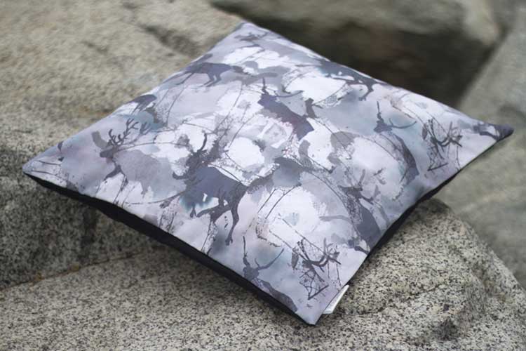 Reindeer surface pattern design on Throw pillo by Susanna Nousiainen